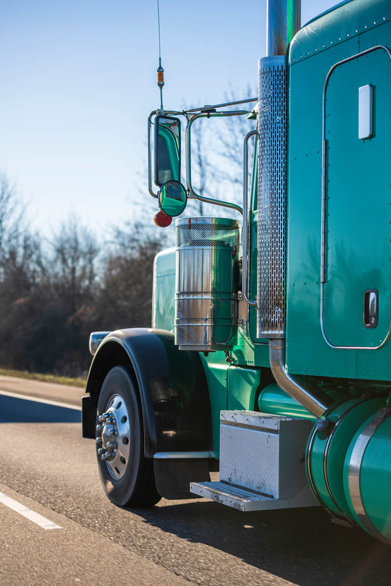 The side of a green diesel truck - DPF services offered at DPF Alternatives in Huntsville / Albertville, AL.