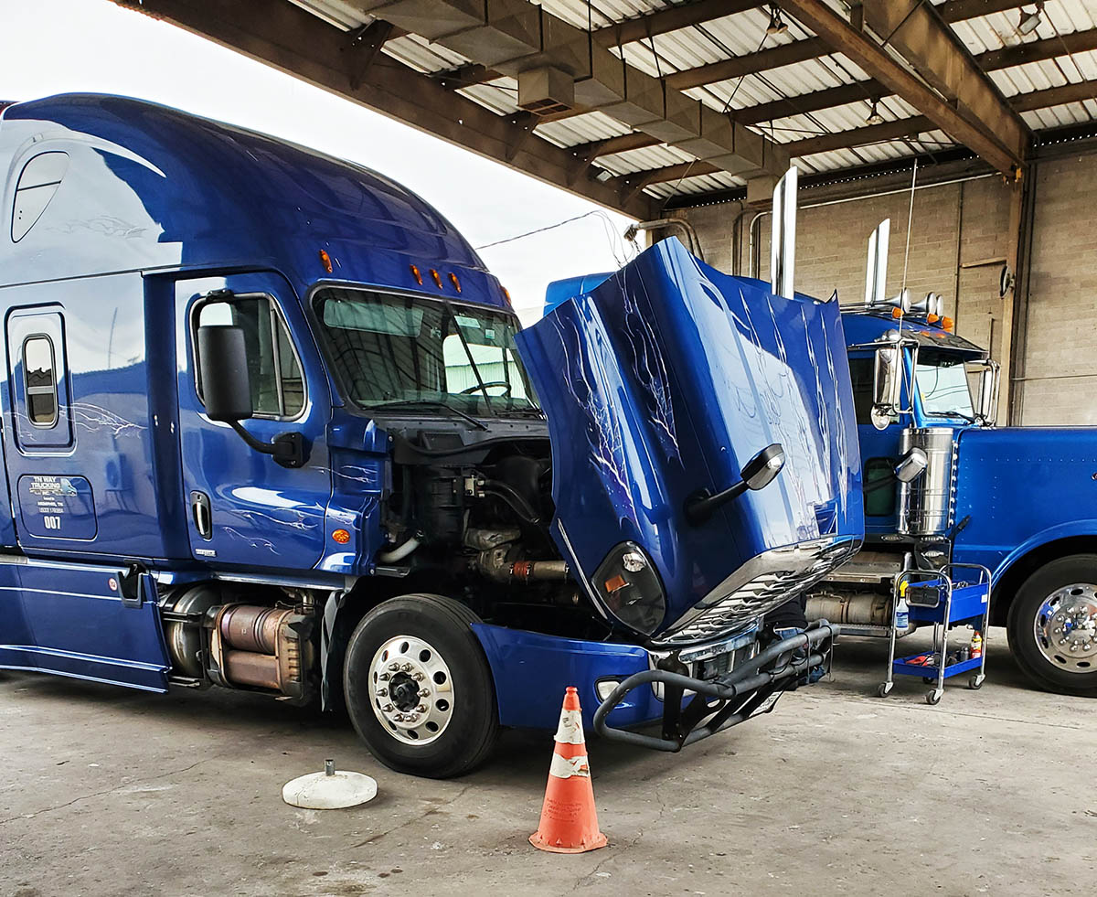 Diseal trucks at a DPF Alternatives shop being serviced by our expert mechanics.