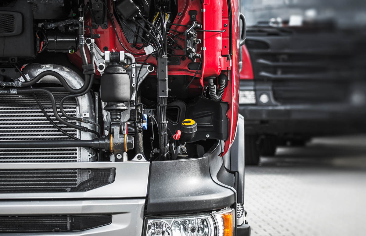 A red truck serviced by DPF Alternatives - we provide installation and repairs to keep your truck running smoothly, including the DPF one box.